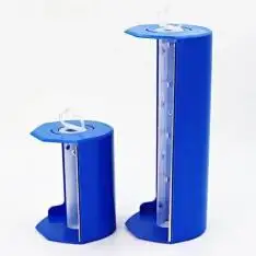 Plastic masking film dispenser holding a pre-taped film roll in a workshop